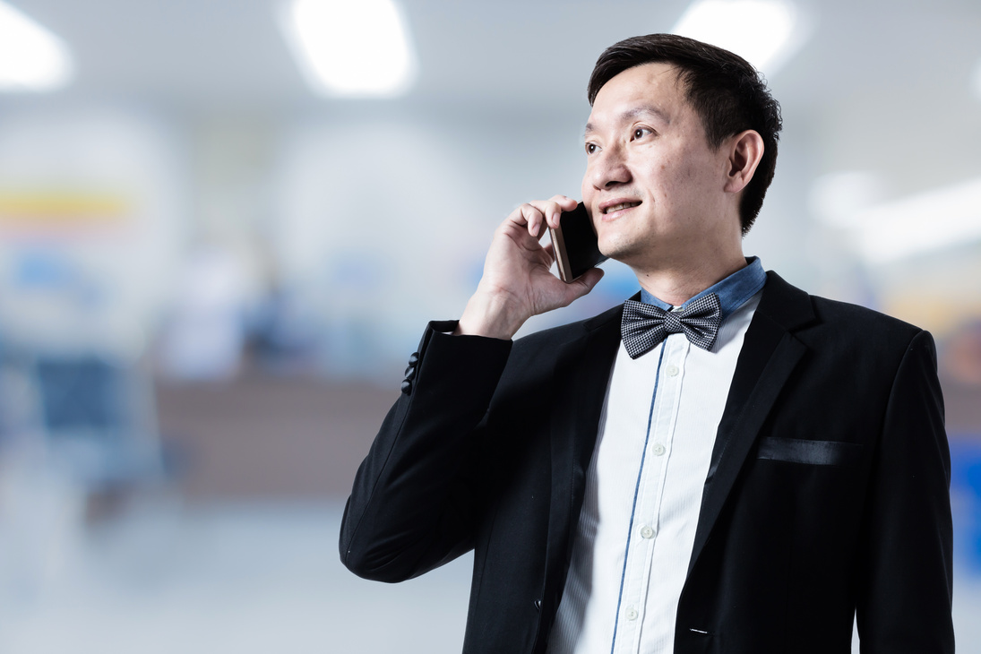 asian businessman in suit with blur background profile photo usage